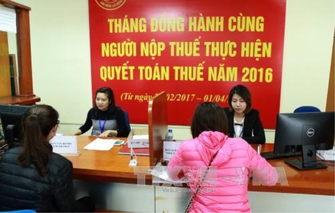 Tạo điều kiện tối đa cho người nộp thuế. Ảnh minh họa tại Cục thuế Hà Nội. Ảnh: Hoàng Hùng/TTXVN